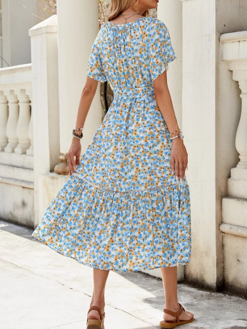 Blue floral print ruffle hem midi dress with tie front waist and short sleeves