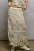 Cream crochet maxi skirt with ruffled waistband and granny square weave pattern in beige and cream tones