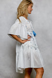White textured relaxed fit mini dress with blue embroidery tassel tie and half flared sleeves