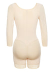 Soft pink long sleeve top featuring floral embroidered patterns