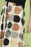 Cream wide leg flowy trousers with large black brown and grey dot print