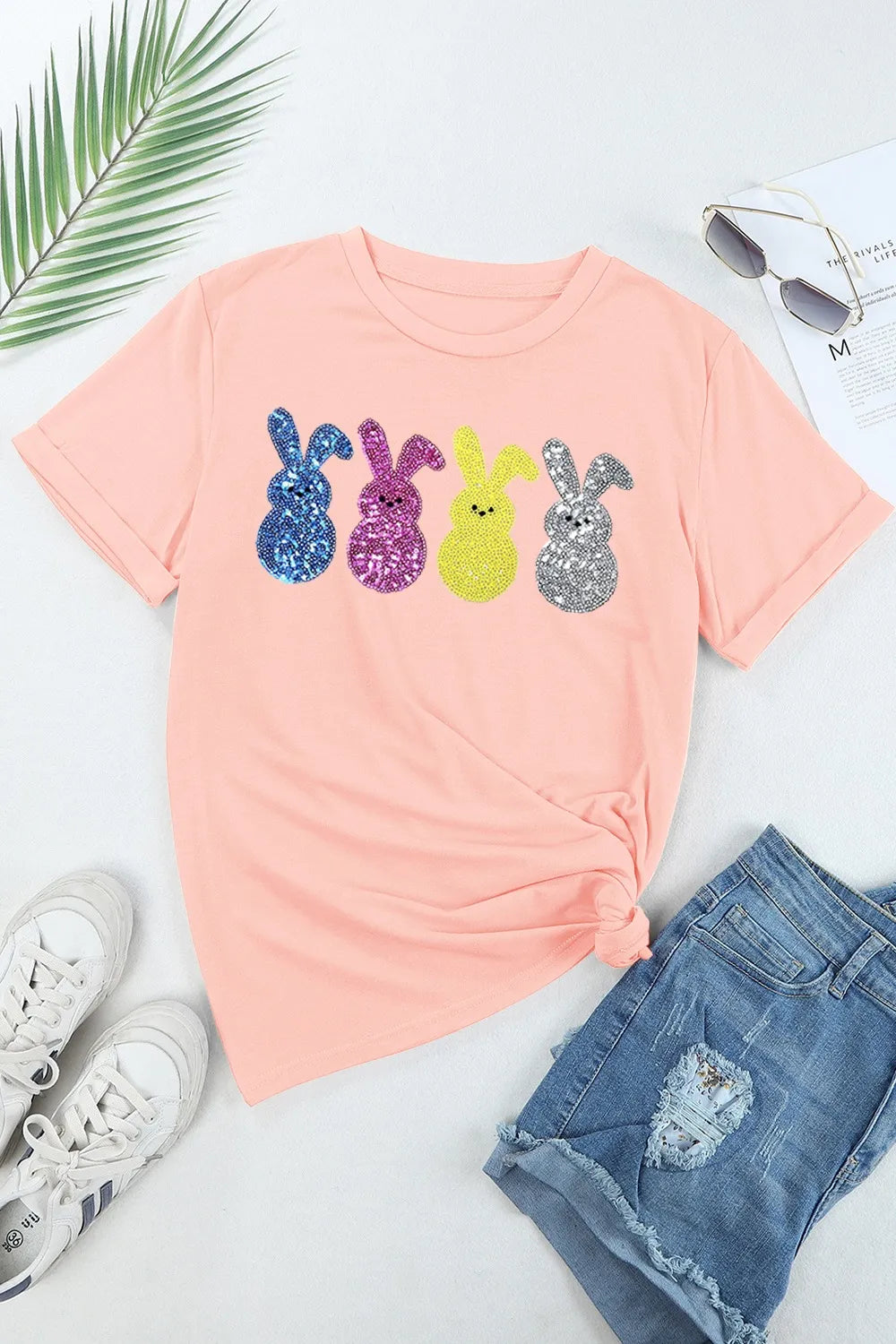 Pink sequin bunny t-shirt with colorful glitter rabbits, soft fabric, knotted fit.