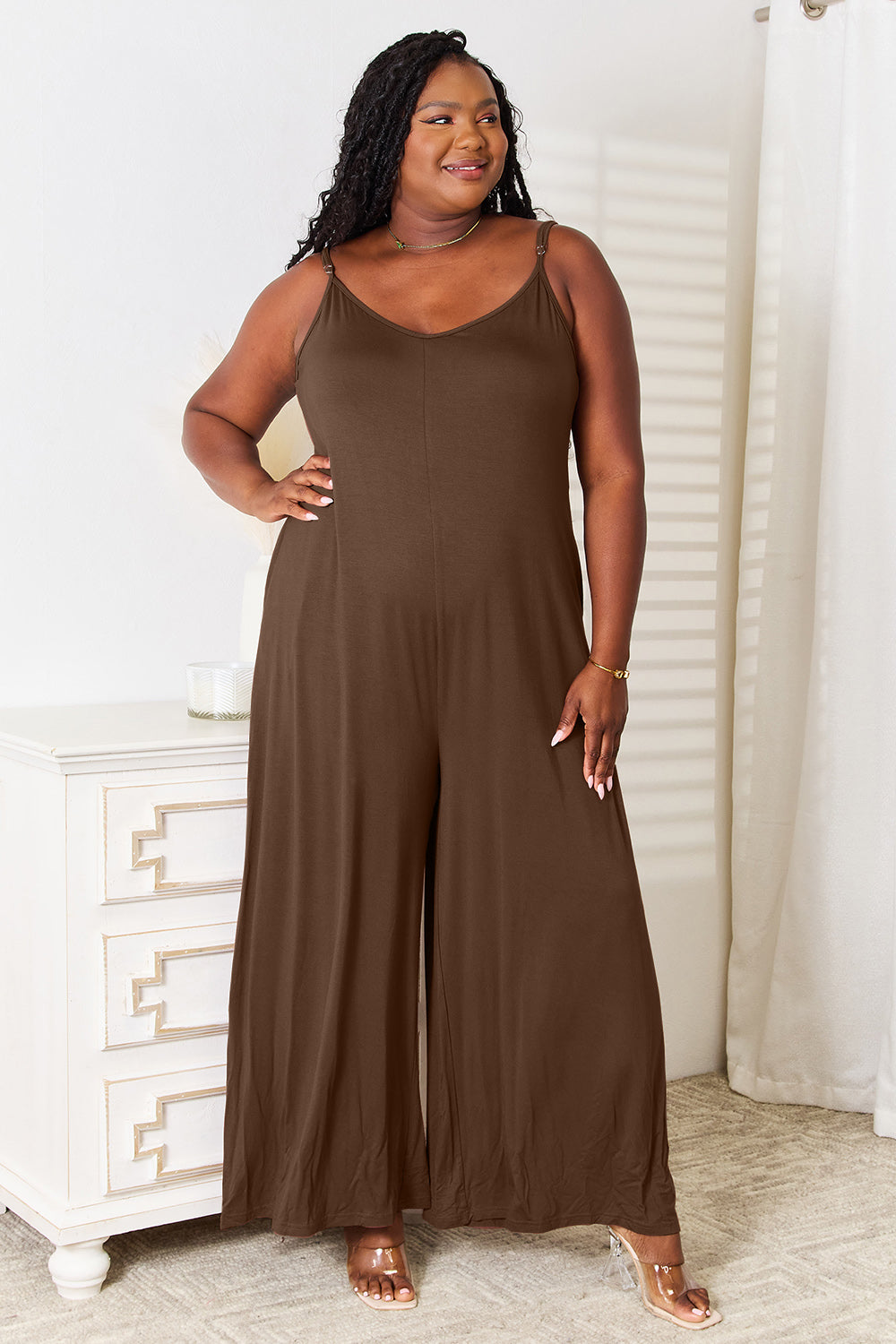 Front view of jumpsuit with tied accent and pockets