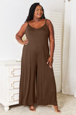 Front view of jumpsuit with tied accent and pockets