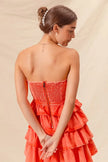 Side view of layered ruffle details on mini dress