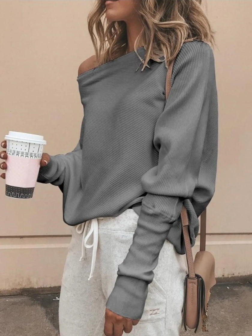 Off-shoulder knit top with ribbed neckline detail and smooth texture