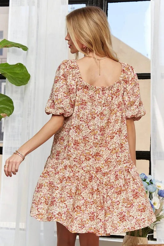Dress front view showcasing floral pattern and puff sleeves