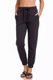 Close-up of soft cotton-polyester fabric on black joggers