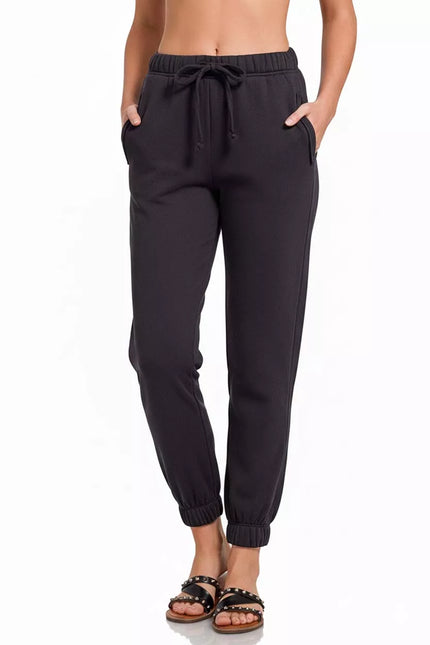 Close-up of soft cotton-polyester fabric on black joggers