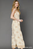 Close-up of floral printed wide-leg jumpsuit fabric drape