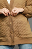 Cozy Jacquard cardigan draped over shoulders highlighting relaxed fit