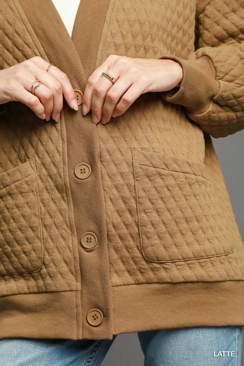 Cozy Jacquard cardigan draped over shoulders highlighting relaxed fit