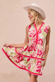 Coral pink floral tiered ruffle mini dress with rose pattern and red trim