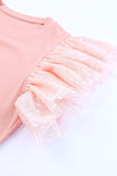 Pink ribbed blouse with polka dot ruffled cap sleeves and soft texture.