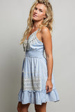 Light blue eyelet embroidered mini dress with smocked waist and ruffled hem