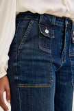 Dark indigo high-waisted wide-crop utility jeans with durable cotton blend, patch pocket, and elongating fit.