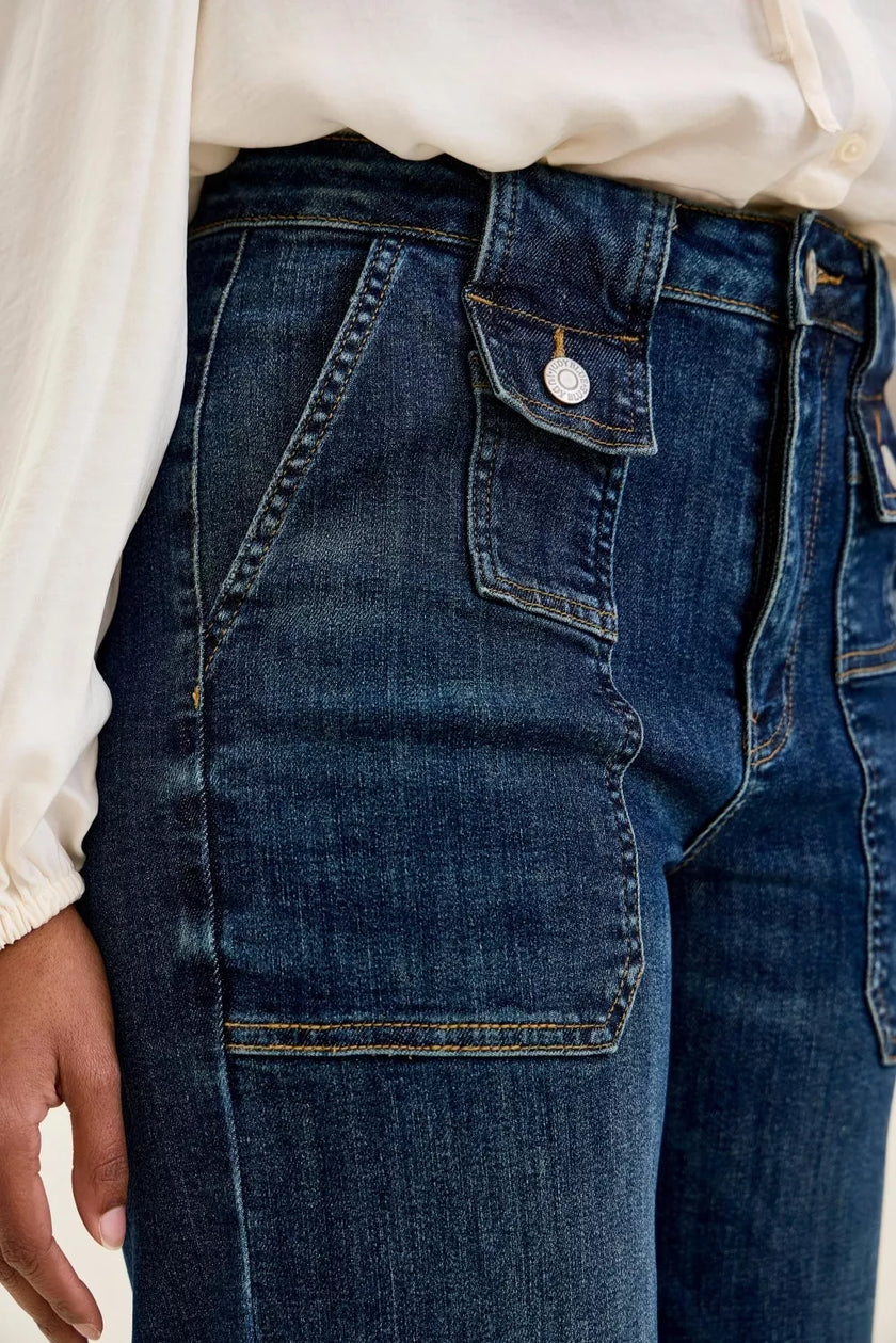 Dark indigo high-waisted wide-crop utility jeans with durable cotton blend, patch pocket, and elongating fit.