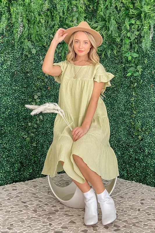 Lime green cotton gauze baby doll dress with ruffled sleeves and tiered skirt fit