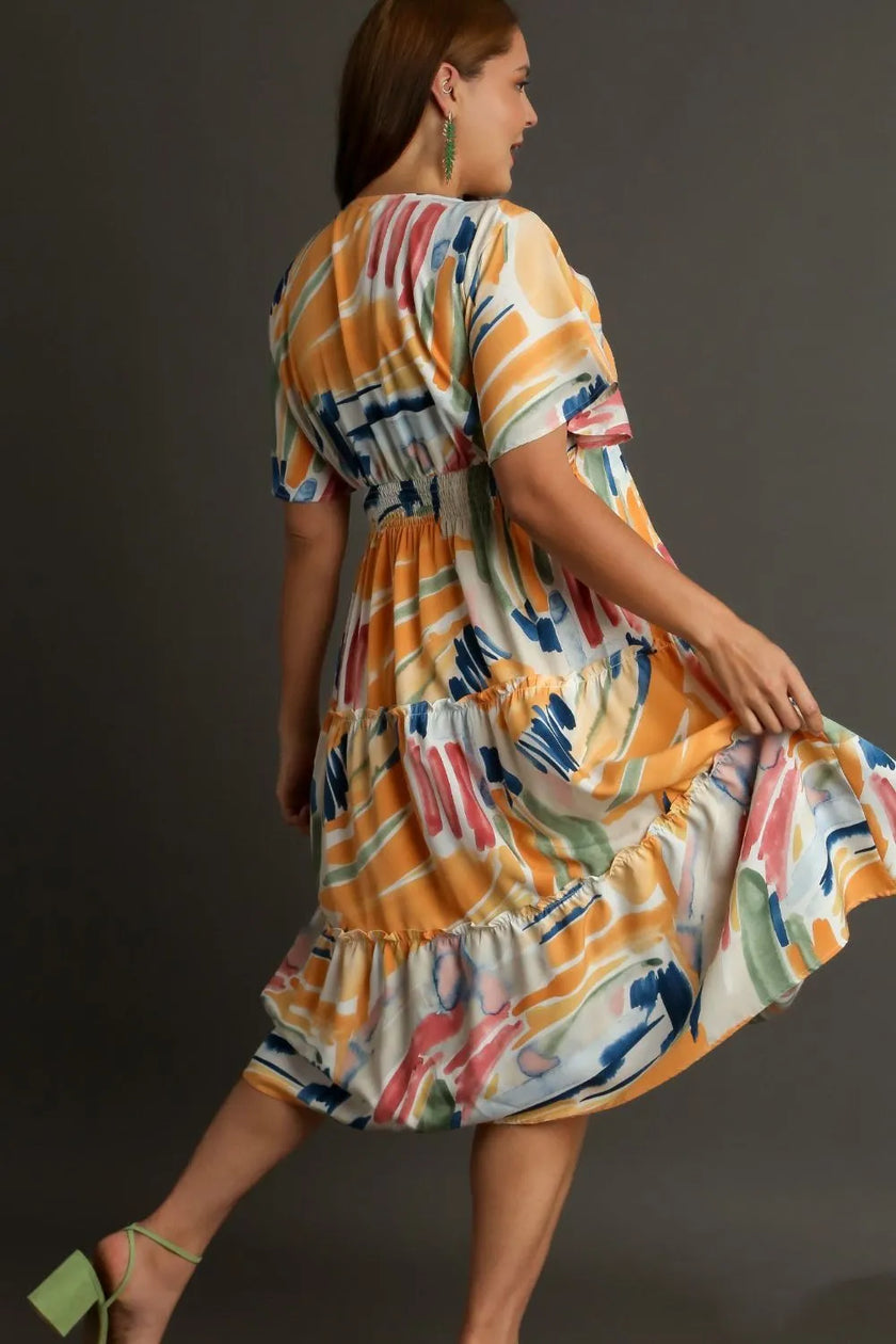 Vibrant abstract print flutter sleeve tiered midi dress with ruffled hem and elastic waist