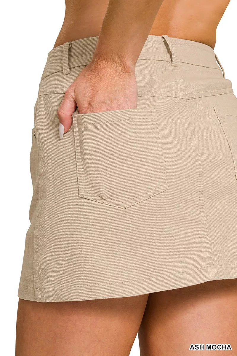 Beige cotton twill mini skirt with a slim fit and front patch pockets