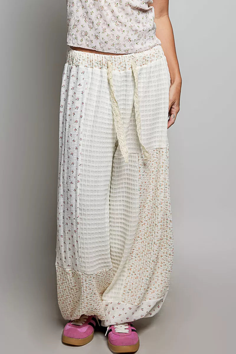 White patchwork mixed knit wide leg balloon pants with lace detail and floral prints