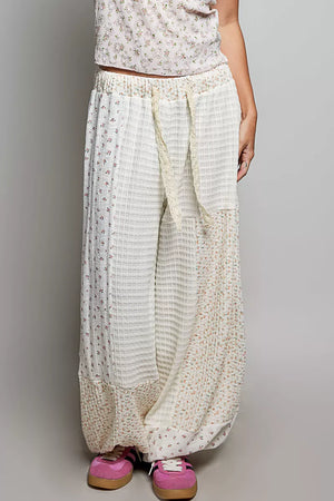 White patchwork mixed knit wide leg balloon pants with lace detail and floral prints