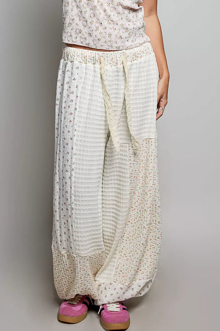 White patchwork mixed knit wide leg balloon pants with lace detail and floral prints