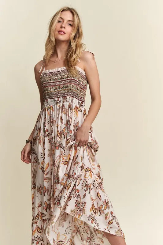 Close-up of smocked bodice and tie shoulder design on rayon midi dress