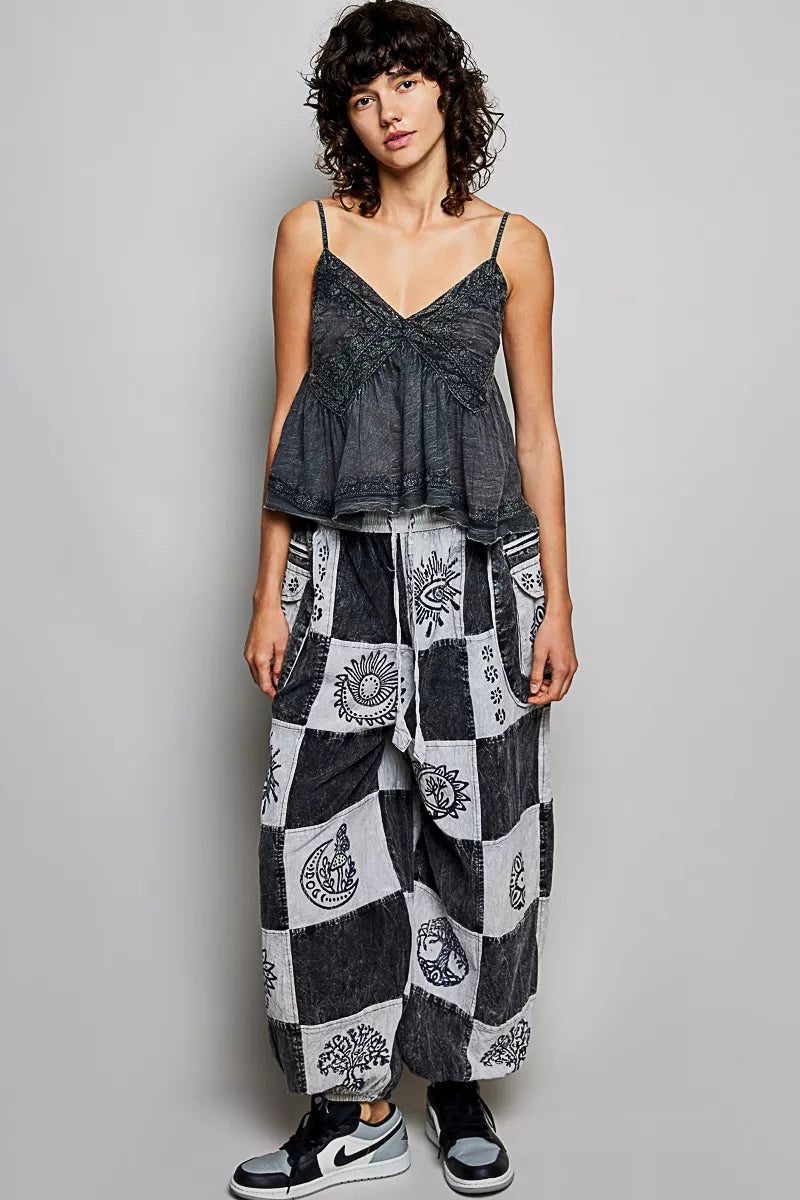 High-rise grey and white patchwork joggers with Aztec print and drawstring waist fit