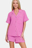 Bright mauve pink button-down lounge top with white piping and chest pocket