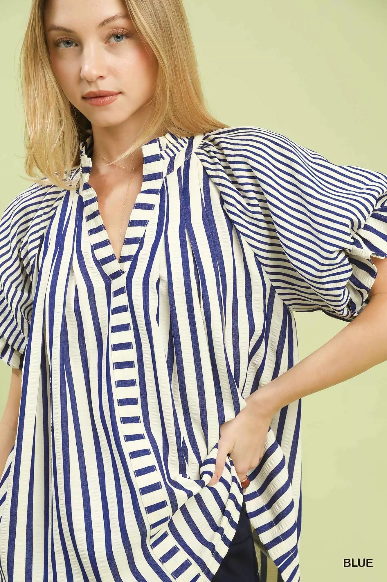 Soft flutter sleeves on modern striped top design
