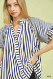 Soft flutter sleeves on modern striped top design