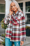 Shirt jacket showing front button detailing and plaid pattern in warm tones