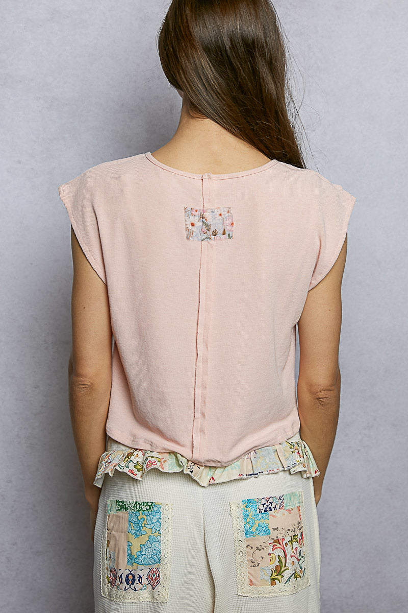 Pink cropped t-shirt with floral patch and lace trim on back