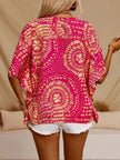 V-neck printed top in bold pink and gold, loose fit, polyester blend texture