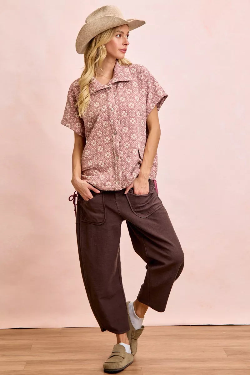 Mocha brown terry pants with relaxed wide-leg silhouette and front detail