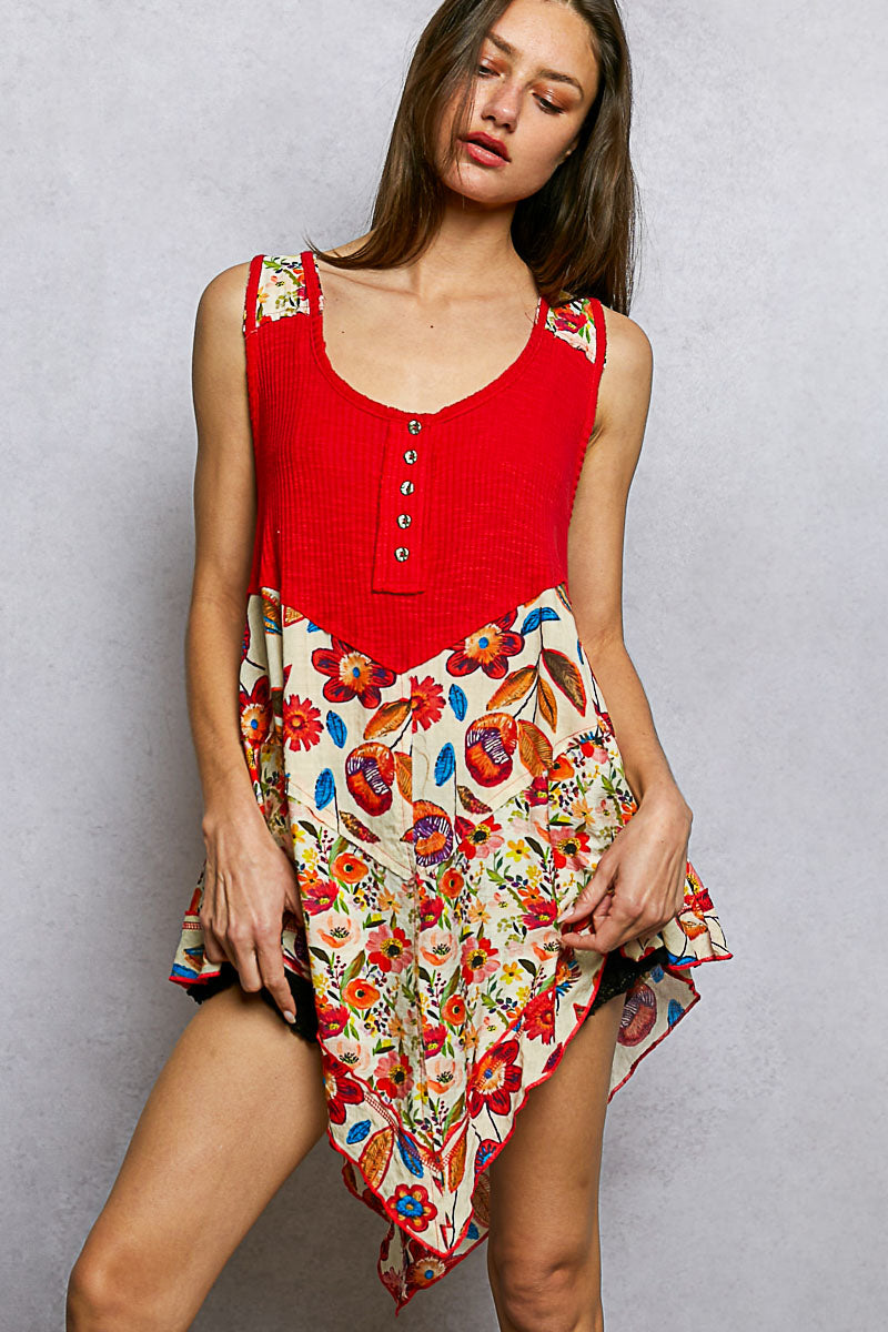 Red ribbed tank with floral print patch hem in vibrant colors and textured knit fabric