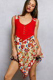 Red ribbed tank with floral print patch hem in vibrant colors and textured knit fabric