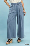 Stone washed light blue wide leg cotton pants with elastic waist and raw hems