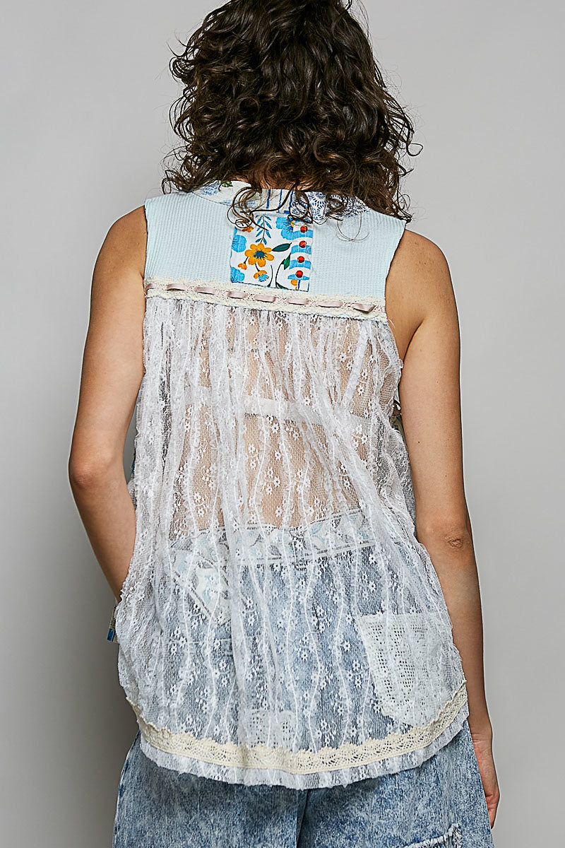 Light blue sheer floral tank top with white lace trim and relaxed fit