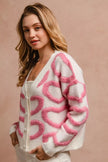White textured cardigan with pink heart pattern, button front, v-neck, cozy knit fit