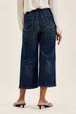 Dark indigo high-waisted wide-leg utility jeans with durable cotton blend, patch pockets, elongating fit, and classic distressed texture
