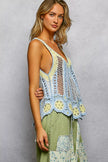 V-neck crochet top showcasing intricate stripe and border weave details