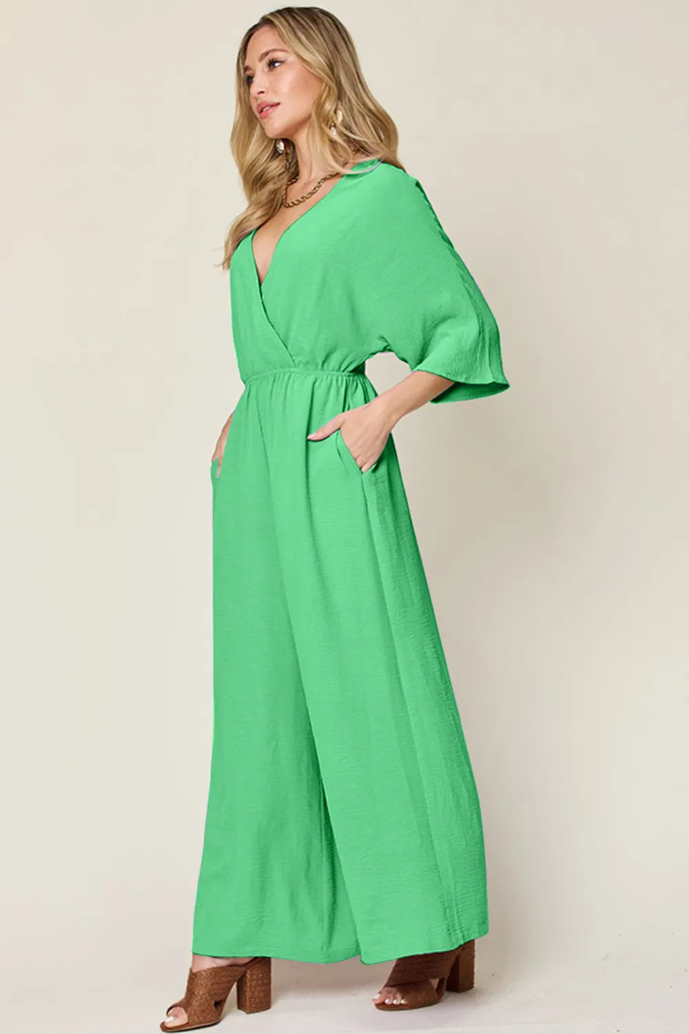 Gray jumpsuit with cropped hem and front panel detail