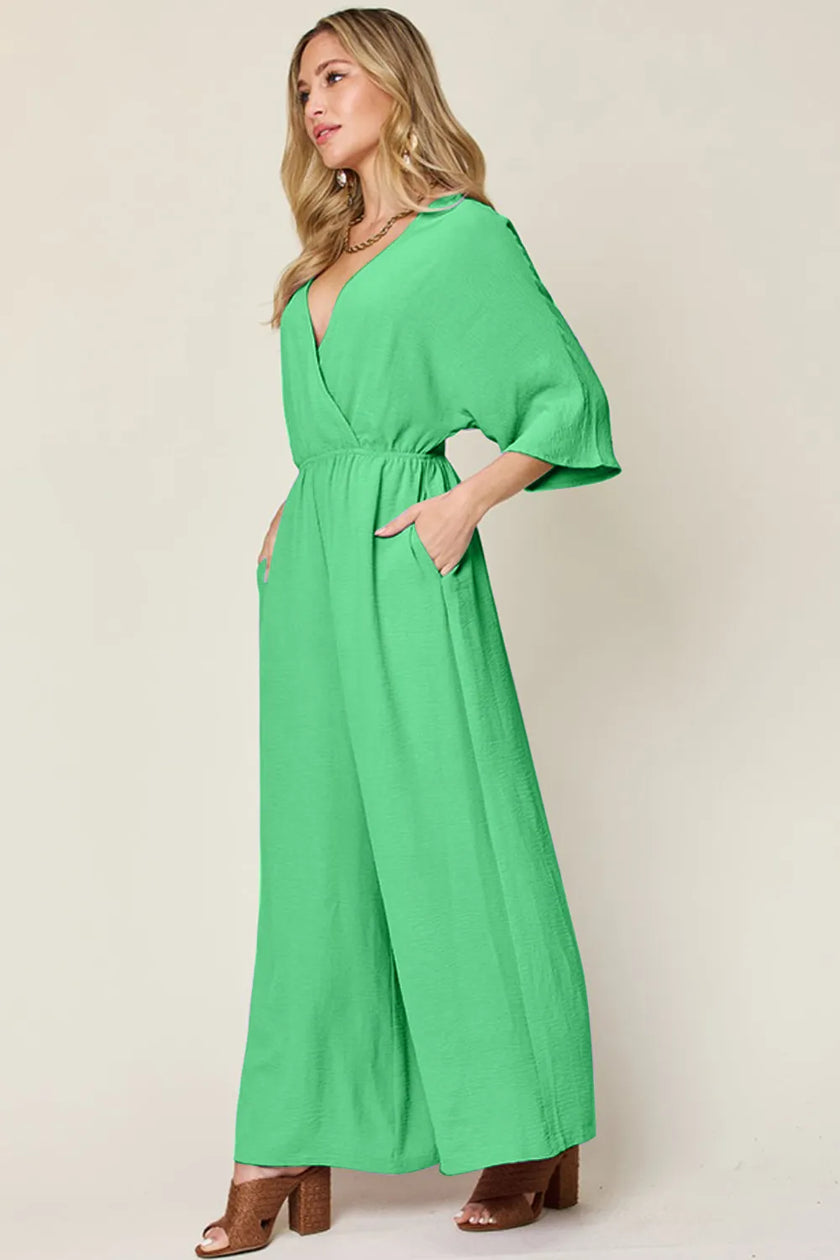 Gray jumpsuit with cropped hem and front panel detail