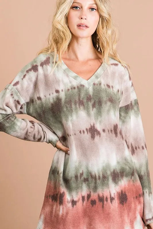 **Bohemian tie-dye top with V-neck, stretchy fabric, multicolor gradient in greens, pinks, and neutrals, casual oversized fit.**