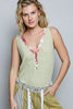 Sage green ribbed v-neck tank top featuring floral contrast trim and slim fit