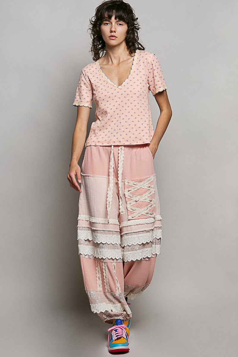Pink ribbed v-neck short sleeve t-shirt with small floral print and relaxed fit