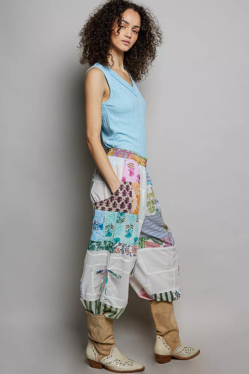 Multicolor patchwork wide leg pants with drawstring sides and mixed printed fabric textures