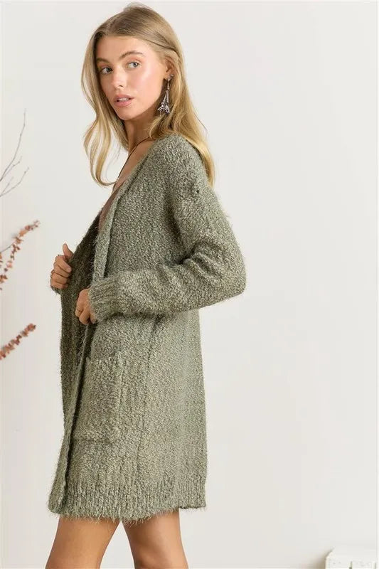 Close-up of soft olive green knit cardigan front detail